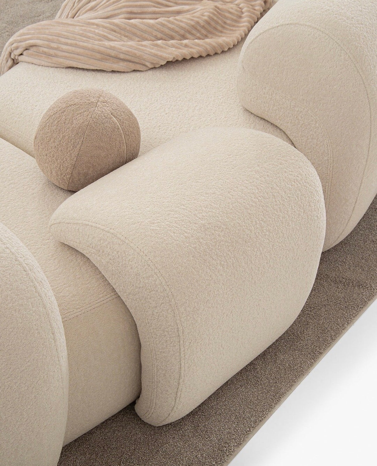Aureum luxury furniture collection featuring modern neutral living room seating, sculptural dining set, and illuminated contemporary bedroom design.