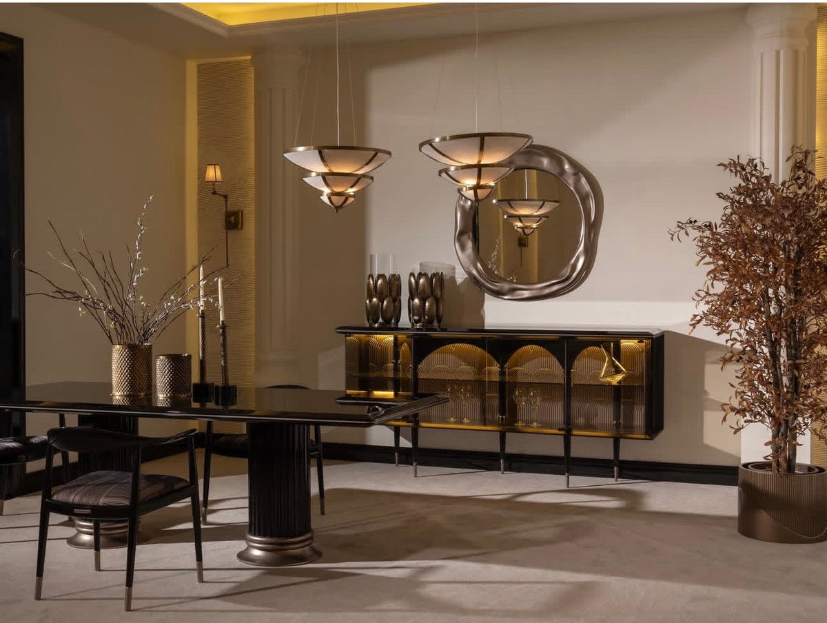 Velvetroom luxury furniture collection featuring elegant sofa seating, modern dining table, illuminated cabinetry, and sculptural pendant lighting.