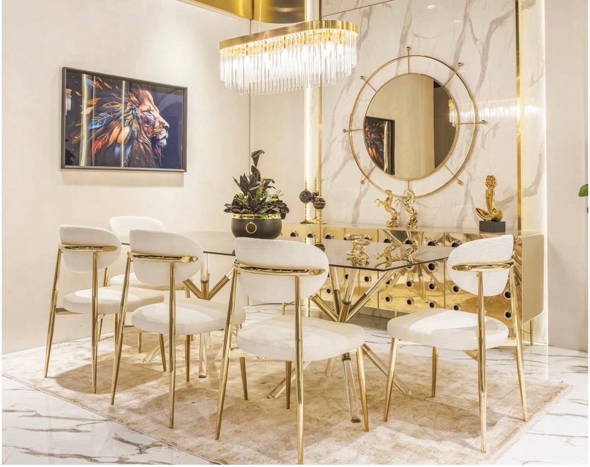 Ivory luxury furniture collection with gold sideboard, marble walls, white seating, and modern high-end living and dining design.