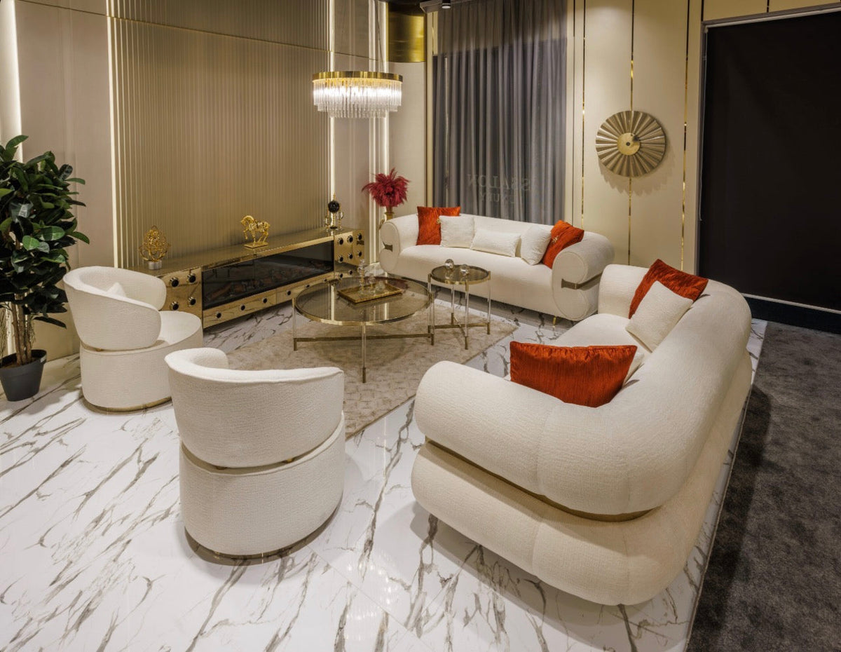 Ivory luxury furniture collection with gold sideboard, marble walls, white seating, and modern high-end living and dining design.