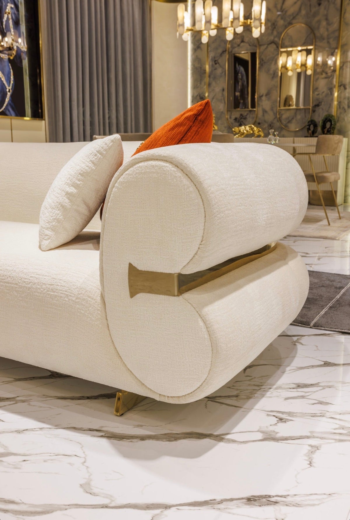 Ivory luxury furniture collection with gold sideboard, marble walls, white seating, and modern high-end living and dining design.